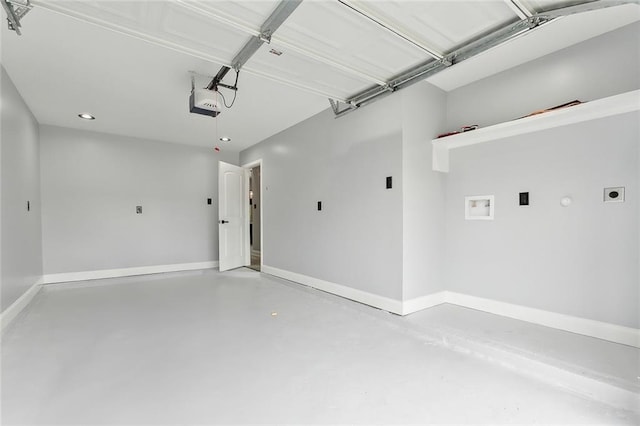 1938 W Homestead Dr, New Orleans, LA 70114 - garage with baseboards, a garage door opener, and recessed lighting