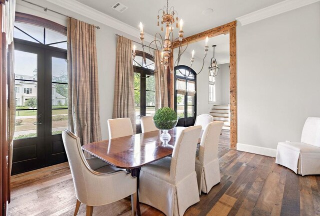 26 Hummingbird Rd, Covington, LA 70433 - dining area with french doors, baseboards, plenty of natural light, and crown molding