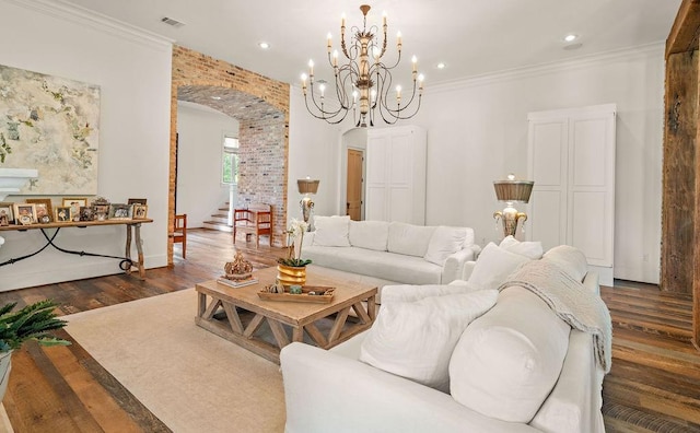 26 Hummingbird Rd, Covington, LA 70433 - living room featuring arched walkways, dark wood-type flooring, a chandelier, recessed lighting, and crown molding
