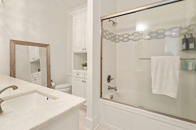 26 Hummingbird Rd, Covington, LA 70433 - bathroom featuring vanity, toilet, and shower / bath combination with glass door