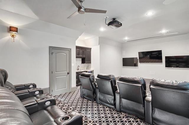 26 Hummingbird Rd, Covington, LA 70433 - cinema room featuring a ceiling fan, carpet flooring, recessed lighting, and a sink