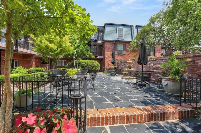 3201 St Charles Ave Unit 230, New Orleans, LA 70115 - view of patio with outdoor dining area