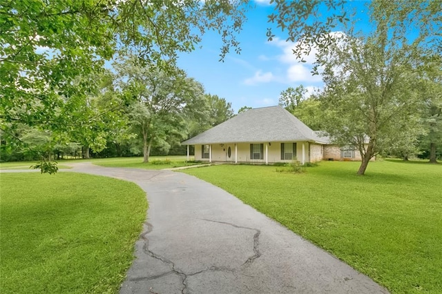 37112 Harper Ln, Pearl River, LA 70452 - view of home's community with a lawn, driveway, and view of wooded area