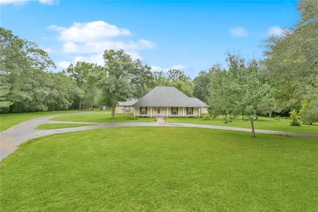 37112 Harper Ln, Pearl River, LA 70452 - view of property's community featuring curved driveway and a lawn