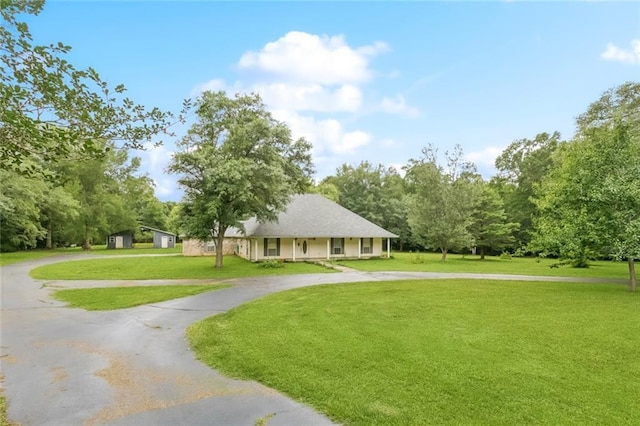37112 Harper Ln, Pearl River, LA 70452 - view of community featuring curved driveway and a yard