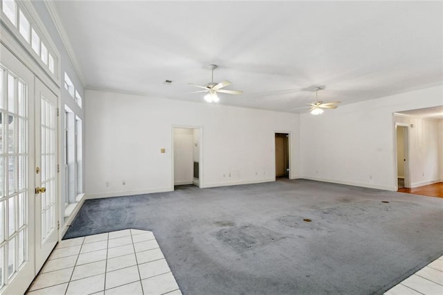 37112 Harper Ln, Pearl River, LA 70452 - unfurnished living room featuring carpet floors, a ceiling fan, ornamental molding, french doors, and baseboards