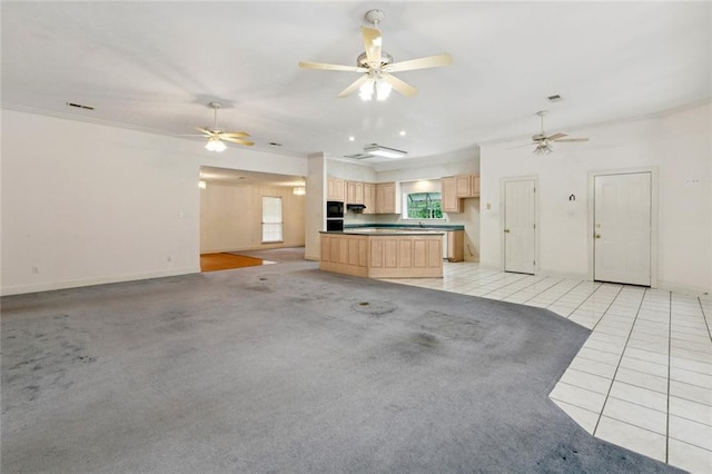 37112 Harper Ln, Pearl River, LA 70452 - unfurnished living room featuring light tile patterned floors, baseboards, a ceiling fan, and light carpet