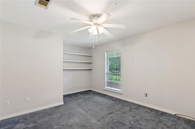 37112 Harper Ln, Pearl River, LA 70452 - unfurnished room featuring dark colored carpet, a ceiling fan, and baseboards
