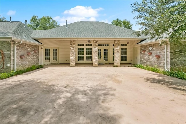 37112 Harper Ln, Pearl River, LA 70452 - back of property with french doors, a shingled roof, ceiling fan, brick siding, and a patio area