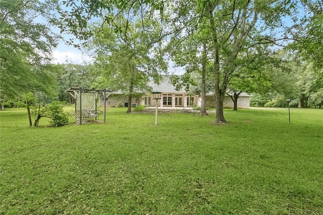 37112 Harper Ln, Pearl River, LA 70452 - view of grassy yard featuring a pergola