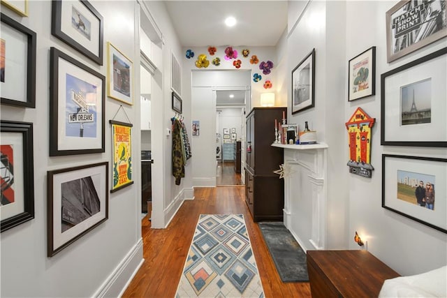 155 Alix St, New Orleans, LA 70114 - hallway with dark wood-style flooring, recessed lighting, and baseboards