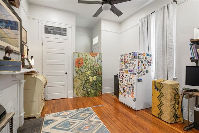 155 Alix St, New Orleans, LA 70114 - interior space featuring freestanding refrigerator, wood-type flooring, and a ceiling fan