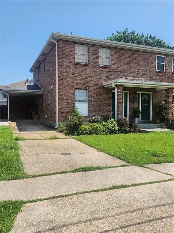 3711 Brandywine Dr Unit 3711, Metairie, LA 70002 - view of front of home with a front lawn, brick siding, and driveway