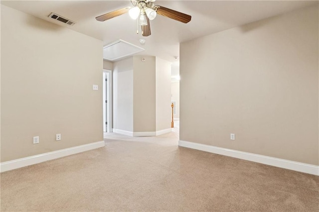 4908 Avron Blvd, Metairie, LA 70006 - spare room featuring attic access, a ceiling fan, and light carpet