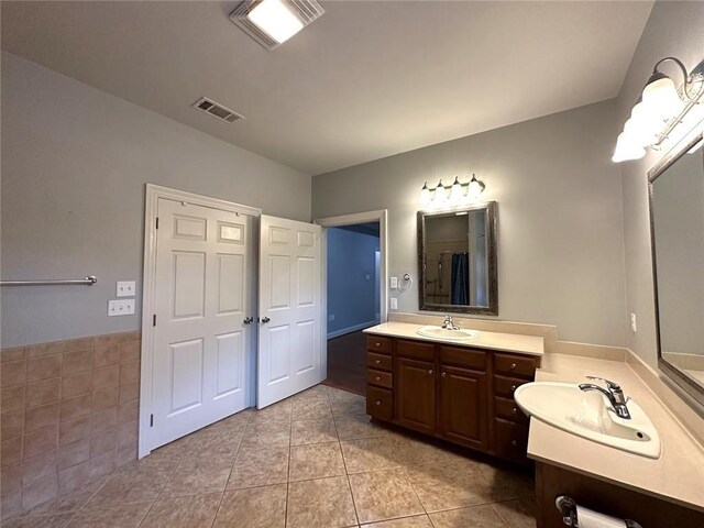 667 Highlands Dr, Slidell, LA 70458 - bathroom with two vanities and tile patterned floors