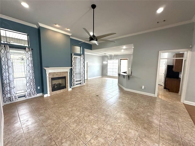 667 Highlands Dr, Slidell, LA 70458 - unfurnished living room with a high end fireplace, a ceiling fan, crown molding, light tile patterned flooring, and recessed lighting