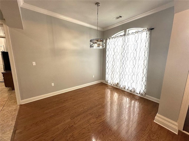 667 Highlands Dr, Slidell, LA 70458 - unfurnished dining area with a chandelier, ornamental molding, baseboards, and wood finished floors