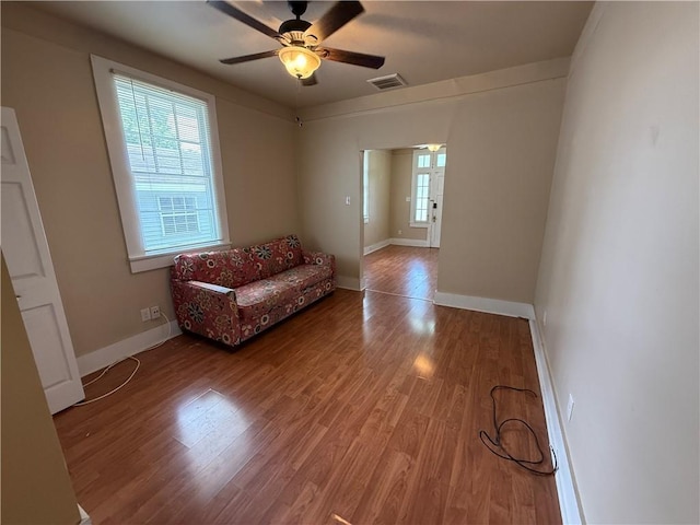 33739 Highway Dr, Jefferson, LA 70121 - living area with plenty of natural light, wood finished floors, a ceiling fan, and baseboards