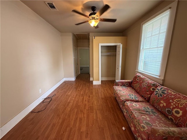 33739 Highway Dr, Jefferson, LA 70121 - bedroom featuring wood finished floors, baseboards, ceiling fan, attic access, and a closet