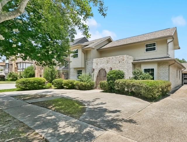 5117 Academy Dr, Metairie, LA 70003 - view of front facade with brick siding