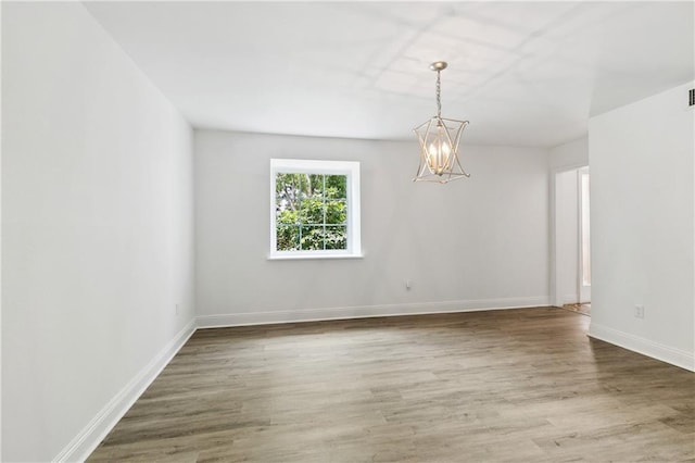 5117 Academy Dr, Metairie, LA 70003 - empty room with a chandelier and wood finished floors