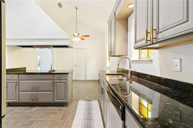 5117 Academy Dr, Metairie, LA 70003 - kitchen with stainless steel dishwasher, gray cabinets, a ceiling fan, vaulted ceiling, and premium range hood