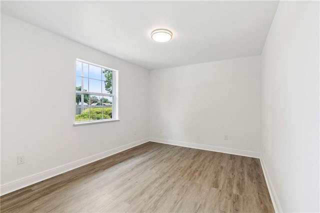 5117 Academy Dr, Metairie, LA 70003 - spare room featuring wood finished floors and baseboards