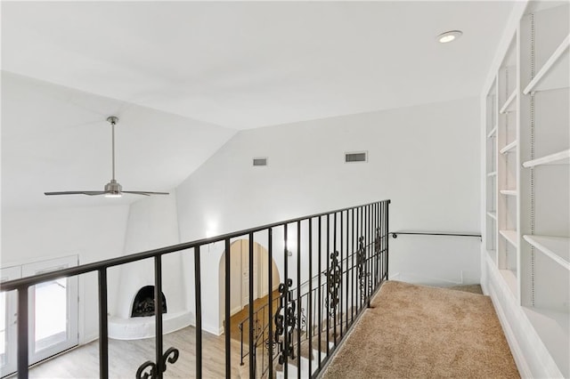 5117 Academy Dr, Metairie, LA 70003 - hall featuring an upstairs landing, vaulted ceiling, and recessed lighting