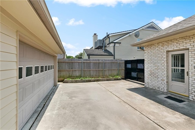 5117 Academy Dr, Metairie, LA 70003 - view of patio / terrace with a garage and driveway