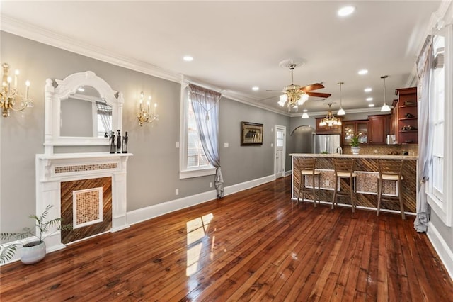 2720 New Orleans St, New Orleans, LA 70119 - living room featuring a chandelier, ceiling fan, crown molding, recessed lighting, and a premium fireplace