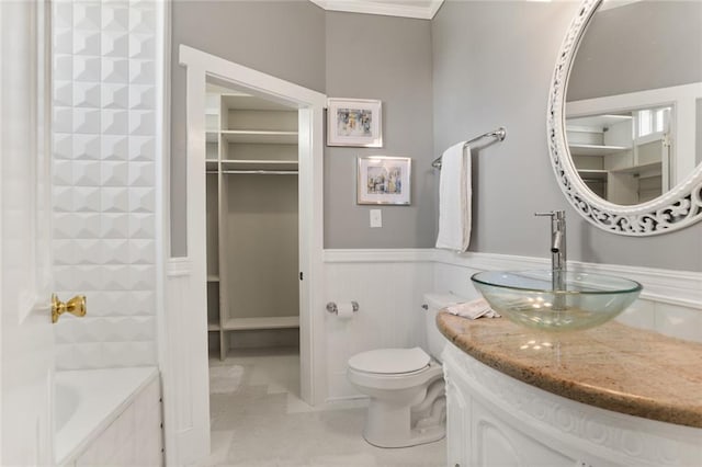 2720 New Orleans St, New Orleans, LA 70119 - bathroom with vanity, a wainscoted wall, toilet, and tile patterned floors