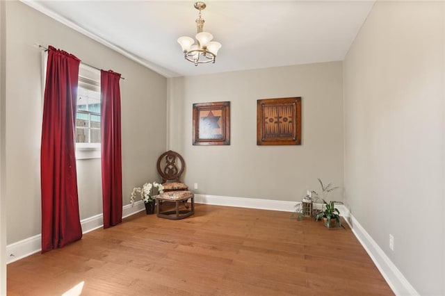 2720 New Orleans St, New Orleans, LA 70119 - living area featuring a chandelier, light wood-style flooring, and baseboards