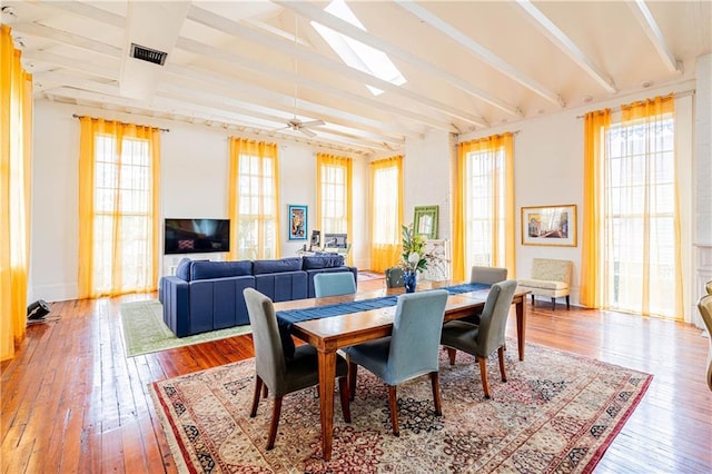1260 Esplanade Ave Unit 2, New Orleans, LA 70119 - dining area with plenty of natural light, a skylight, hardwood / wood-style floors, and baseboards