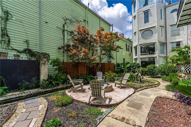 1260 Esplanade Ave Unit 2, New Orleans, LA 70119 - view of yard featuring an outdoor fire pit and a patio