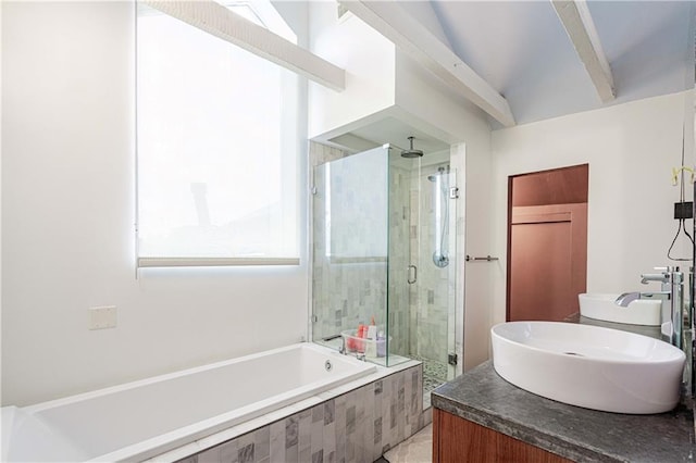1260 Esplanade Ave Unit 2, New Orleans, LA 70119 - full bathroom with a shower stall, a bath, and double vanity