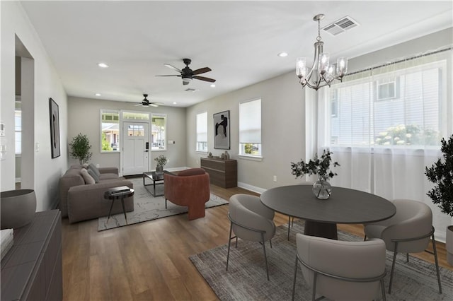 3225 Milan St, New Orleans, LA 70125 - dining room with wood finished floors, recessed lighting, a ceiling fan, a chandelier, and baseboards