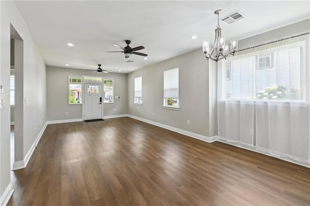 3225 Milan St, New Orleans, LA 70125 - unfurnished living room featuring a chandelier, recessed lighting, dark wood-type flooring, baseboards, and a ceiling fan