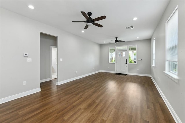 3225 Milan St, New Orleans, LA 70125 - spare room with ceiling fan, dark wood finished floors, recessed lighting, and baseboards