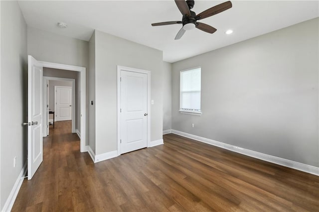 3225 Milan St, New Orleans, LA 70125 - unfurnished bedroom with dark wood-type flooring, baseboards, a ceiling fan, and recessed lighting