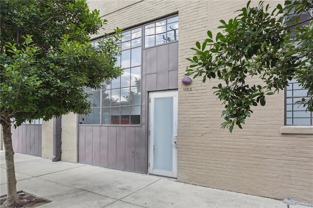 1103 Tchoupitoulas St Unit 102, New Orleans, LA 70130 - doorway to property featuring brick siding