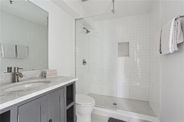 1103 Tchoupitoulas St Unit 102, New Orleans, LA 70130 - full bathroom with vanity, toilet, and a tile shower