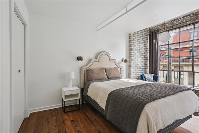 1103 Tchoupitoulas St Unit 102, New Orleans, LA 70130 - bedroom with wood finished floors and baseboards