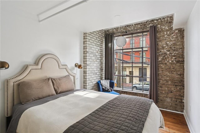 1103 Tchoupitoulas St Unit 102, New Orleans, LA 70130 - bedroom featuring wood finished floors and baseboards