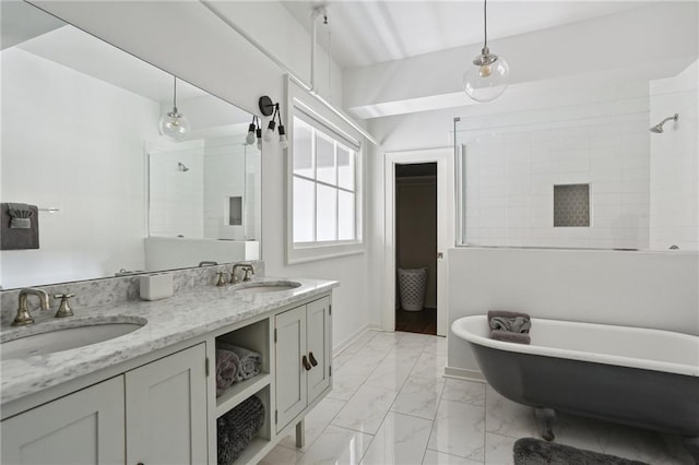 1103 Tchoupitoulas St Unit 102, New Orleans, LA 70130 - full bath featuring a freestanding tub, double vanity, a tile shower, and marble look tiles