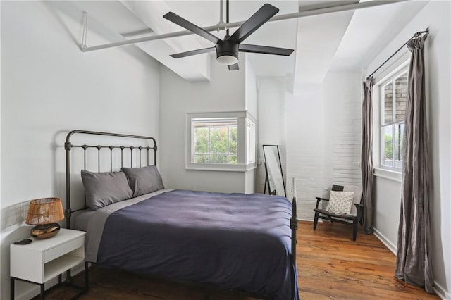 1103 Tchoupitoulas St Unit 102, New Orleans, LA 70130 - bedroom with wood finished floors and a ceiling fan