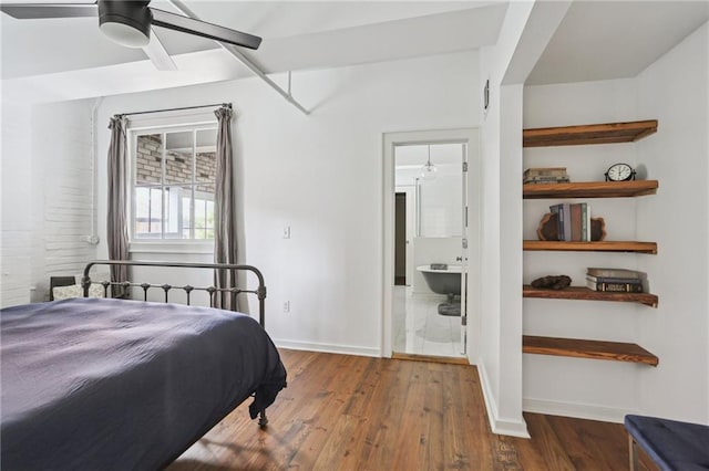 1103 Tchoupitoulas St Unit 102, New Orleans, LA 70130 - bedroom with wood finished floors, baseboards, ensuite bathroom, and ceiling fan