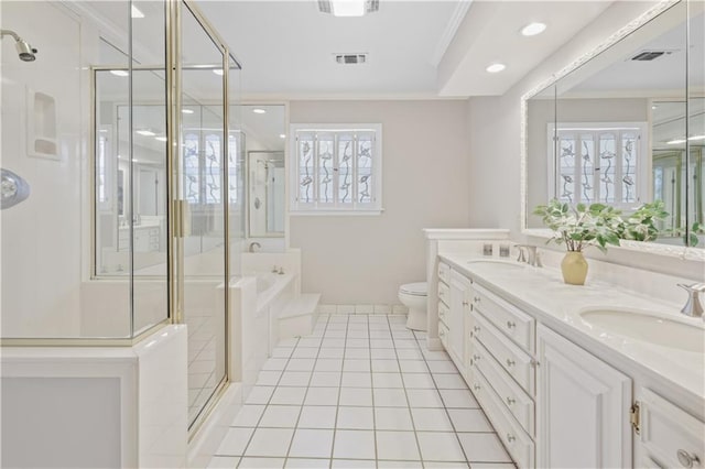 1029 Beverly Garden Dr, Metairie, LA 70002 - full bathroom featuring a shower stall, double vanity, a garden tub, toilet, and recessed lighting