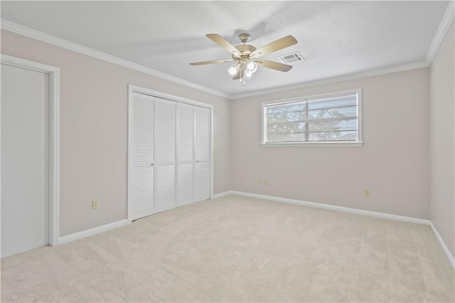 1029 Beverly Garden Dr, Metairie, LA 70002 - unfurnished bedroom featuring light carpet, crown molding, baseboards, and ceiling fan