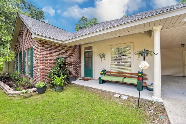 72158 Mill Rd, Abita Springs, LA 70420 - doorway to property with brick siding, roof with shingles, a lawn, and a carport