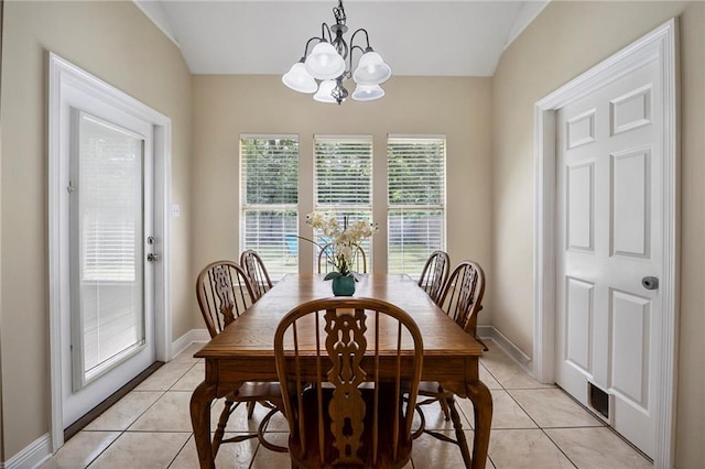72158 Mill Rd, Abita Springs, LA 70420 - dining room with light tile patterned flooring, a chandelier, and baseboards